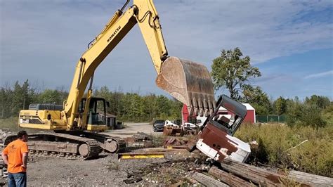 mini excavator knocking down a garage|abandoned house with mini excavator.